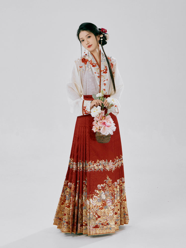 Traditional Chinese clothing with intricate embroidery of plum blossoms and peonies, featuring a layered look with camisole and airplane sleeves