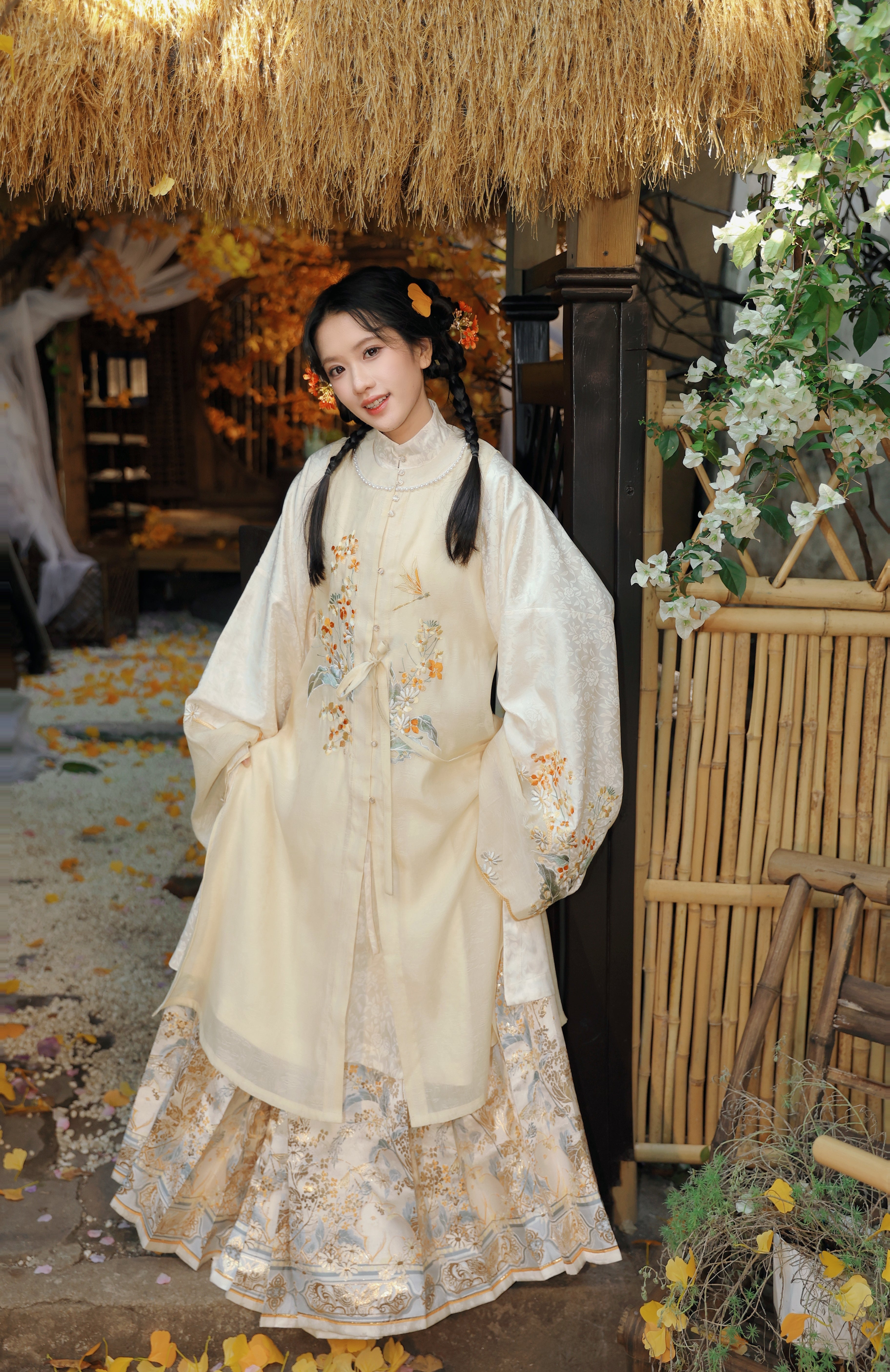 Detail of waistband construction and embroidery on traditional Chinese Mamian skirt, demonstrating authentic Ming Dynasty inspired tailoring techniques and masterful gold thread embroidery craftsmanship