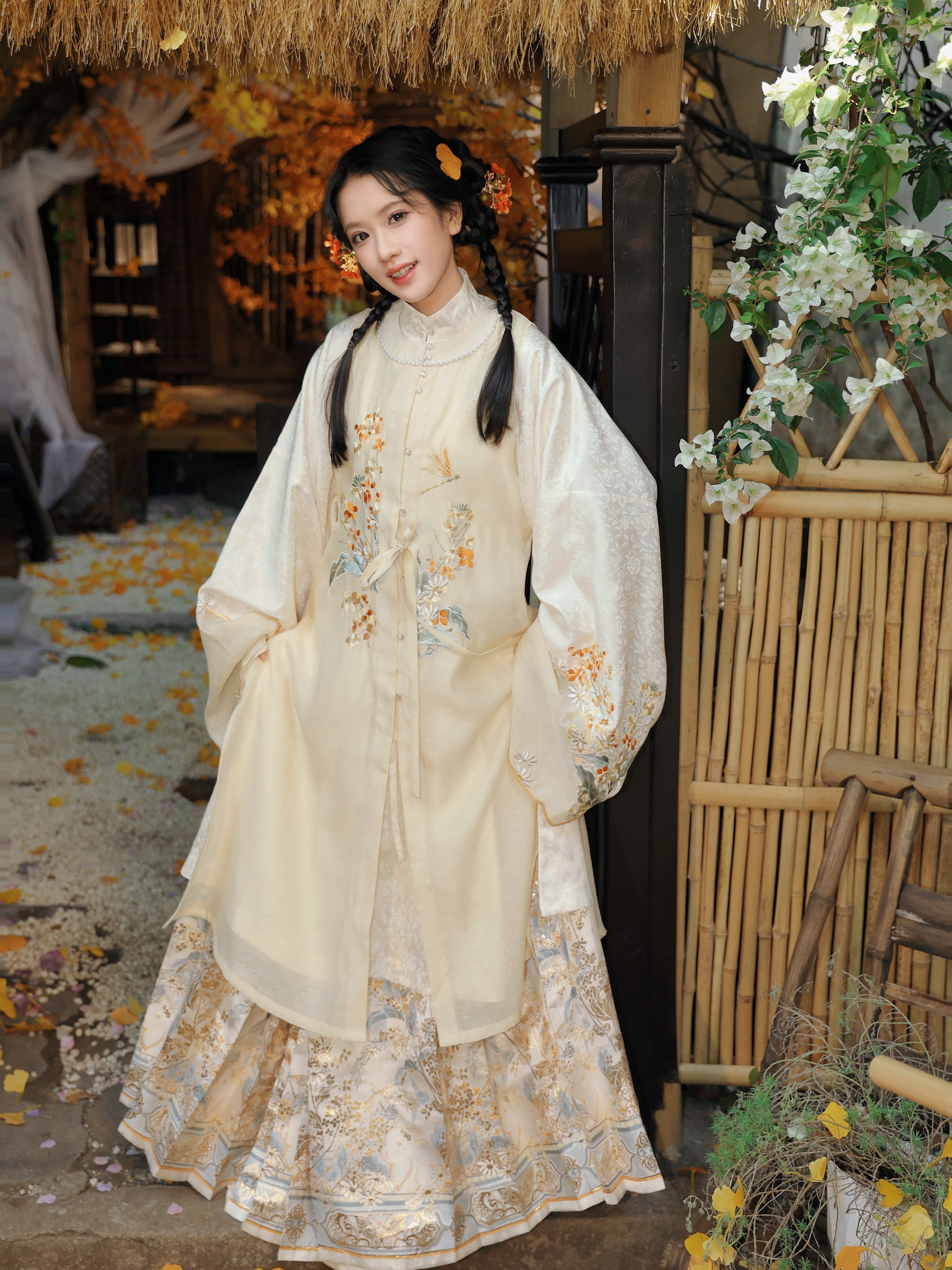 Model wearing cream-colored Mid-Autumn Bunny Mamian Skirt featuring traditional Ming Dynasty horse-face skirt design with exquisite gold thread embroidery of rabbits among flowers