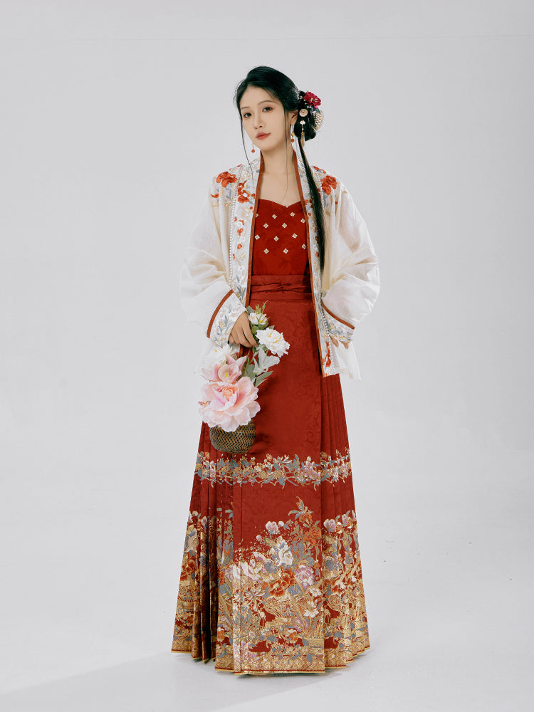 Graceful traditional Chinese dress from the HuaXia Ceremony Collection, displaying detailed floral chronology from plum blossoms to noble orchids